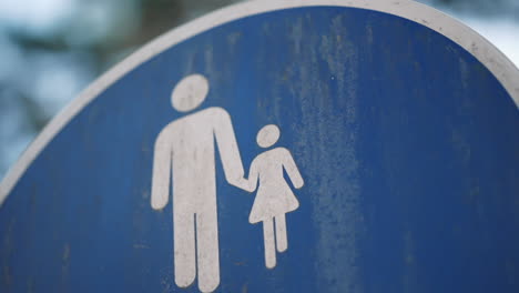 pedestrian sign with adult and child figures