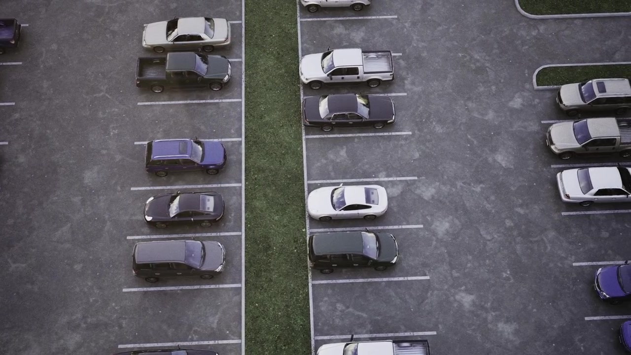 Luz suave da manhã projeta um brilho delicado sobre uma área de estacionamento bem organizada.