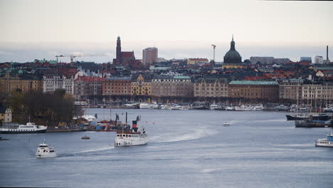 stockholm city silhouette with boats passing