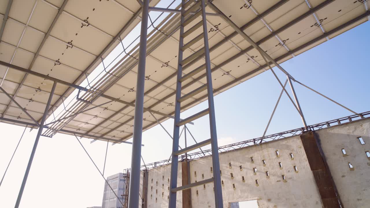 Warehouse Interior With Steel Ladder And Roof Structure Against Blue Sky For Industrial Or Construction Projects And Logistics