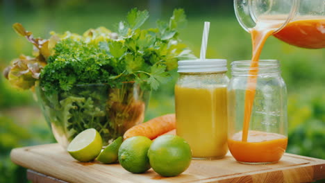 a healthy juice is poured next to a set of fruits and greens