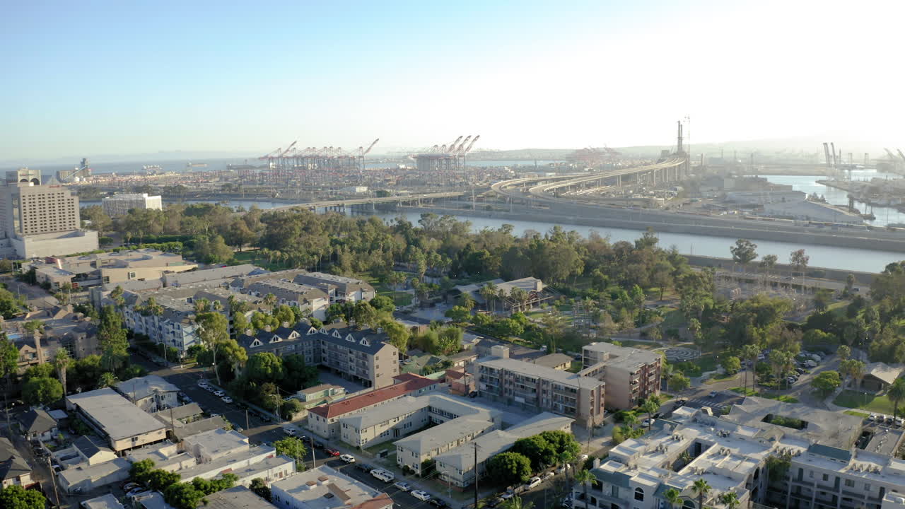 Aerial view of an urban landscape with a large industrial port and residential areas