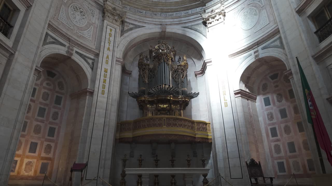 Majestic pipe organ takes center stage within the grand interior of the National Pantheon, Lisbon, Portugal, showcasing intricate details and historical significance