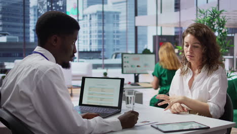 staff interviewing woman applicant job seeker in high end office