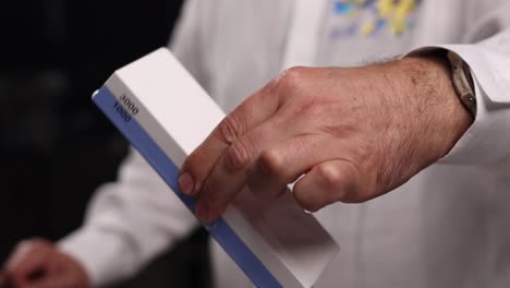 chef sharpening a knife on a stone