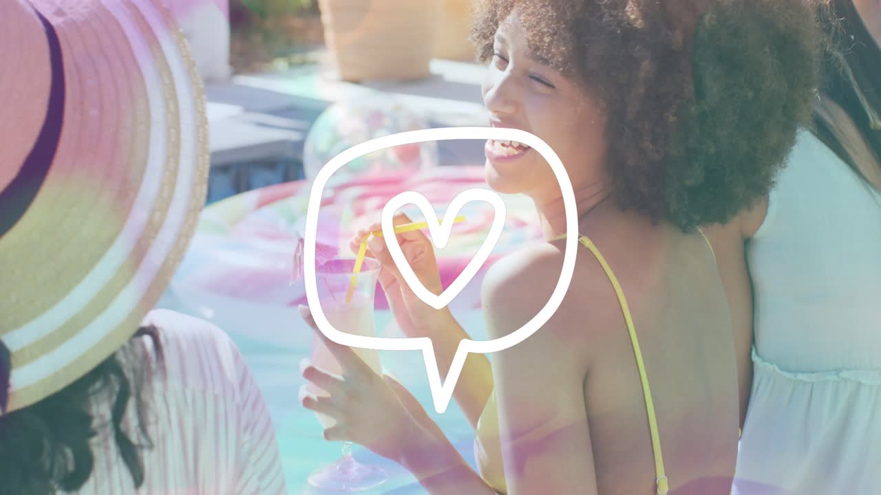 Woman in yellow suit sipping cup, turning to friend, laughing under heart doodle overlay for ads