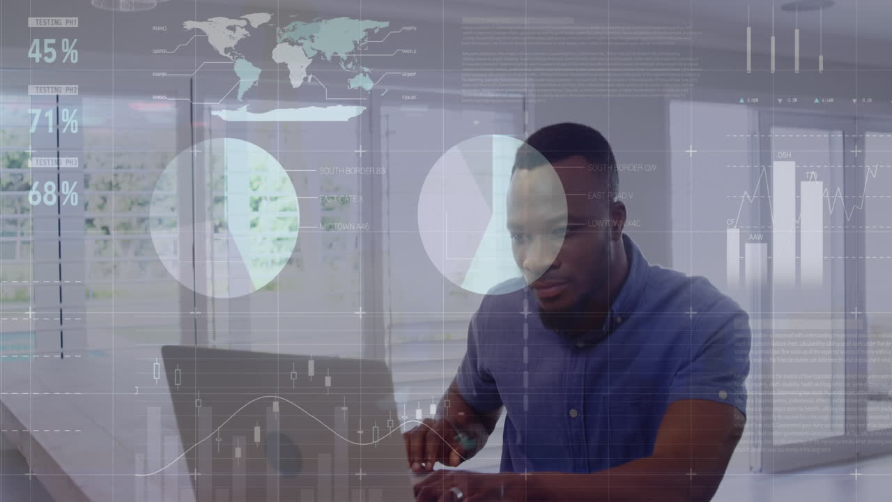 Animation of infographic interface over african american man working on laptop at office