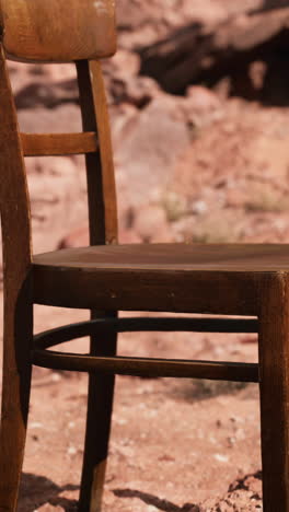 closeup of an old wooden chair in a desert