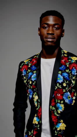 man in embroidered floral jacket