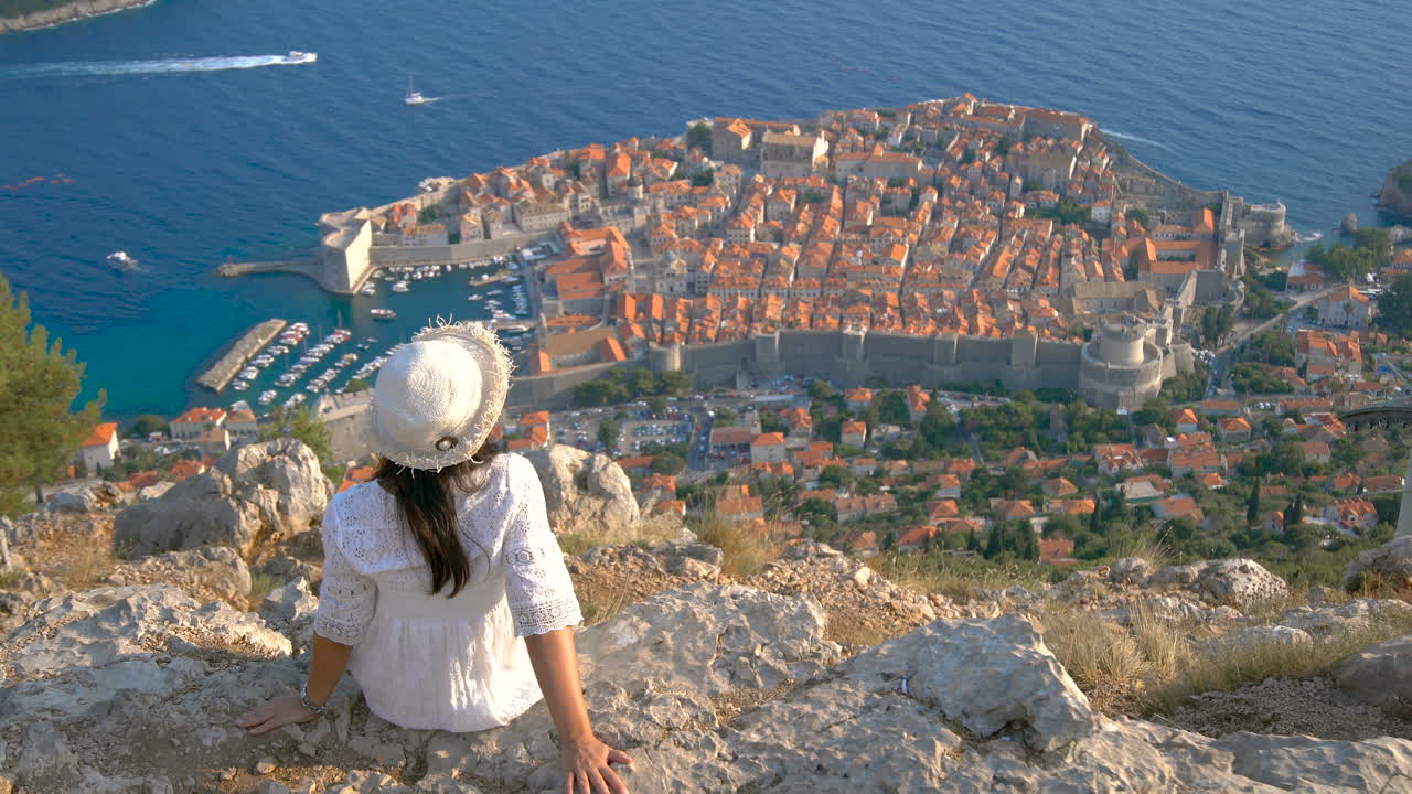 Woman tourist looking at City of Dubrovnik Croatia