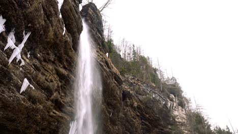 Peričnik-waterfall-in-winter-covered-with-ice-and-snow-in-Mojstrana,-Slovenia