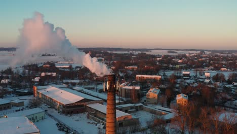 Aerial-view-of-chimney-tower-in-city-release-dense-smoke-in-atmosphere