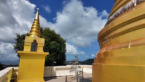 buddhist temple pagoda golden color plated chedi wat khao hua chuk thailand