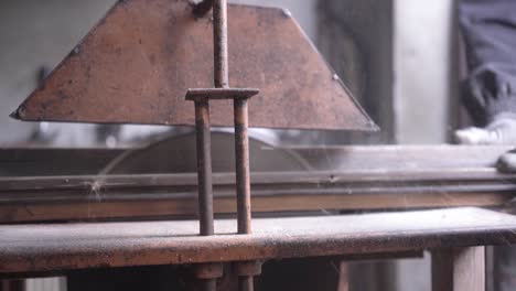 cutting peas of wood on circular saw