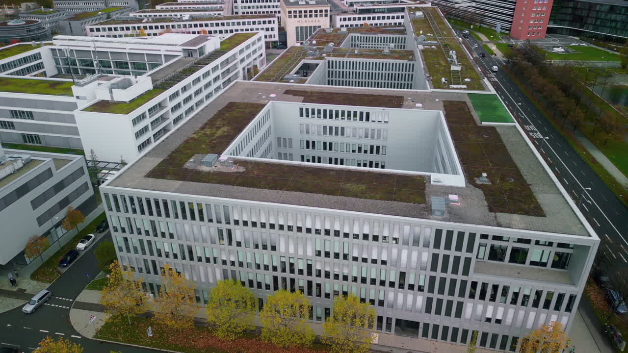 Aerial view of modern office buildings with green roofs