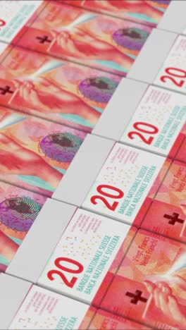 vertical video of 20 swiss franc banknotes printing by a money press