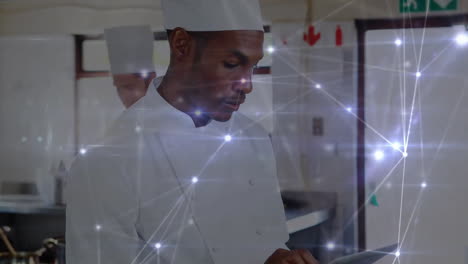 animación de la red de conexiones sobre el chef afroamericano usando la tableta