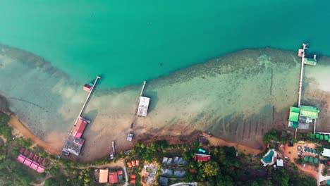 aerial top down resort beach houses at ko chang thailand, blue sea landscape, waterfront view