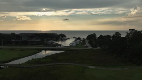 Aerial-reveal-of-marina-near-the-Grand-Hotel-in-Point-Clear,-Alabama