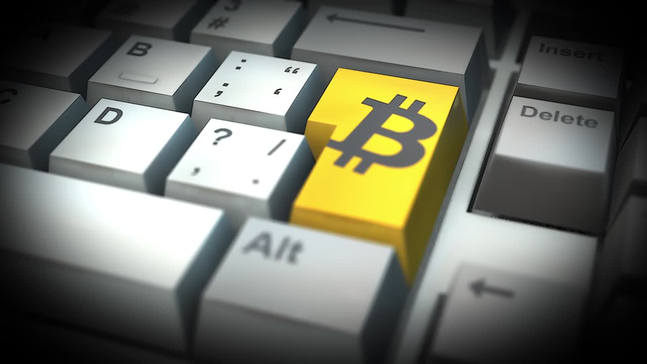 botón de bitcoin en el teclado de la computadora