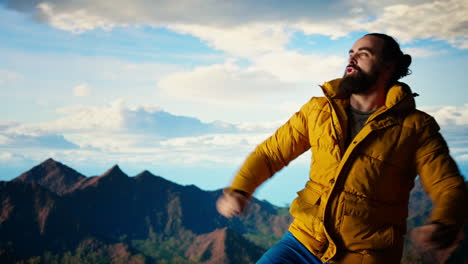 cheerful hiker celebrates climbing the rugged wilderness with a victory dance