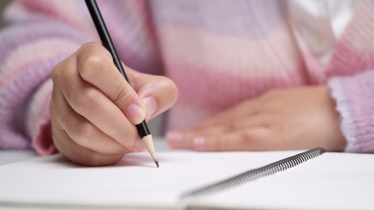 Women are developing ideas, jotting down summaries and designing ideas on notebooks