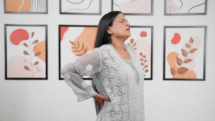 Indian mother having back pain