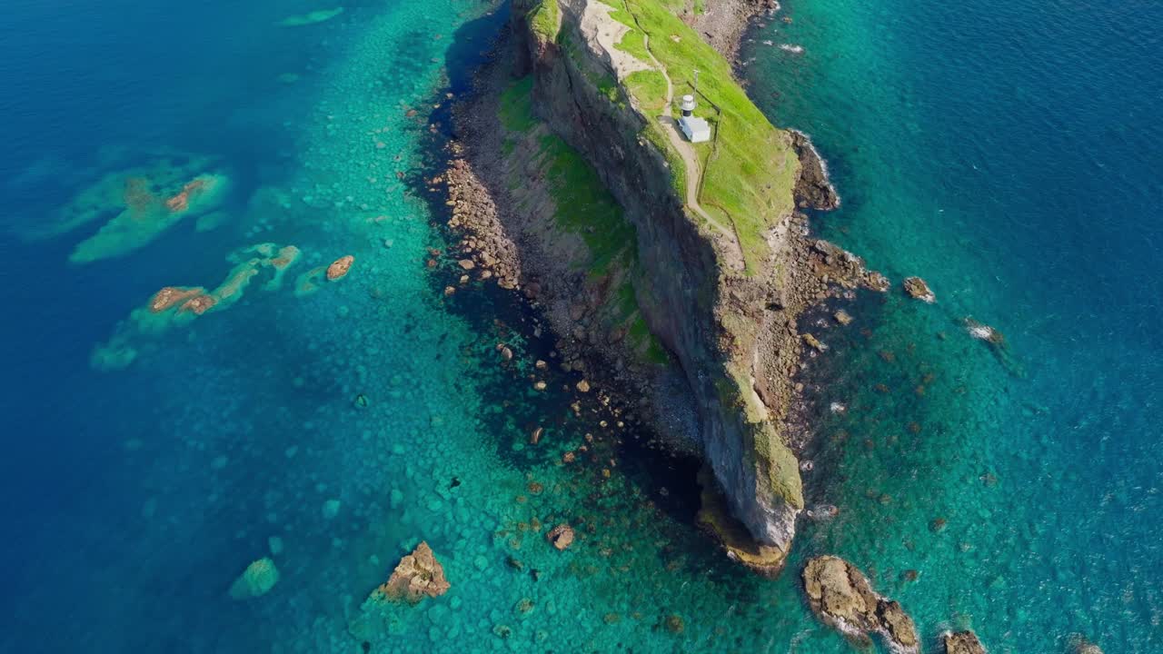 Drone fly above famous cliff in Shakotan Hokkaido, Japanese sea landscape in summer establishing aerial view