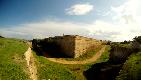 road next to corner famagusta city walls, a deep moat surrounds the old fortress