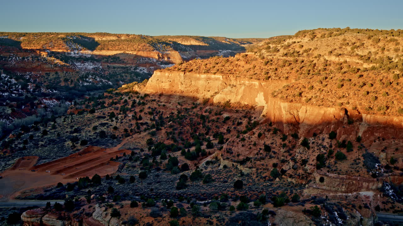 Aerial drone footage soaring high above Canyonlands near Kanab, Utah, at dawn.