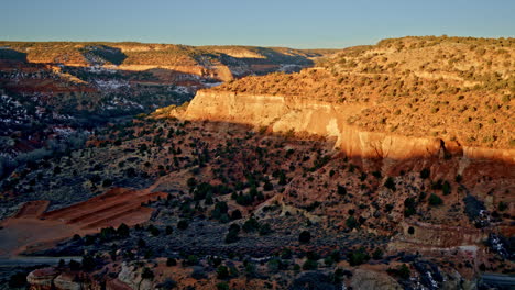 aerial drone footage soaring high above canyonlands near kanab, utah, at dawn.