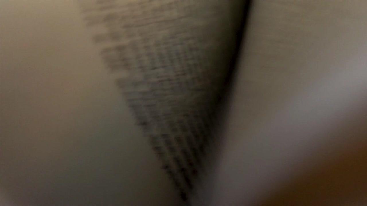 Book Flipping Through Pages Close Up