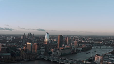 establishing drone shot of central london revealing st pauls cathedral sunrise