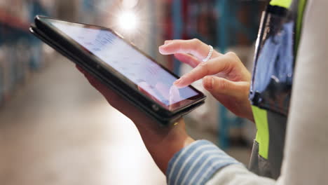 warehouse worker using a tablet for inventory management