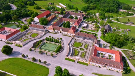 Schloss-Hof-Castle-With-Baroque-Gardens-In-Austria---aerial-shot