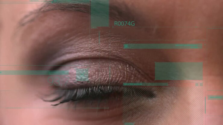 Closed eye with digital data processing animation over eyelid and surrounding skin