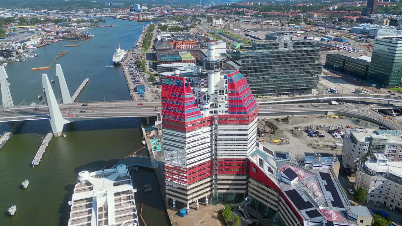 Aerial around 'The Lipstick' building and the newly built Hisingsbron Bridge over Gota Alv River In Gothenburg City, Sweden