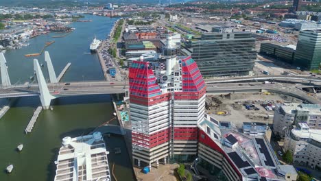 Aerial-around-'The-Lipstick'-building-and-the-newly-built-Hisingsbron-Bridge-over-Gota-Alv-River-In-Gothenburg-City,-Sweden