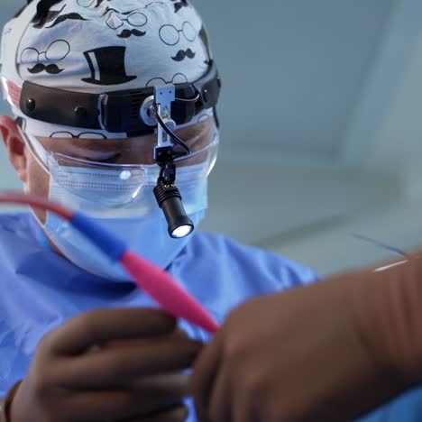 in surgery. medical team performing operation in hospital operating theater. working with surgical instruments