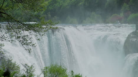 A-waterfall-of-a-pure-wild-river-located-in-a-green-rainforest