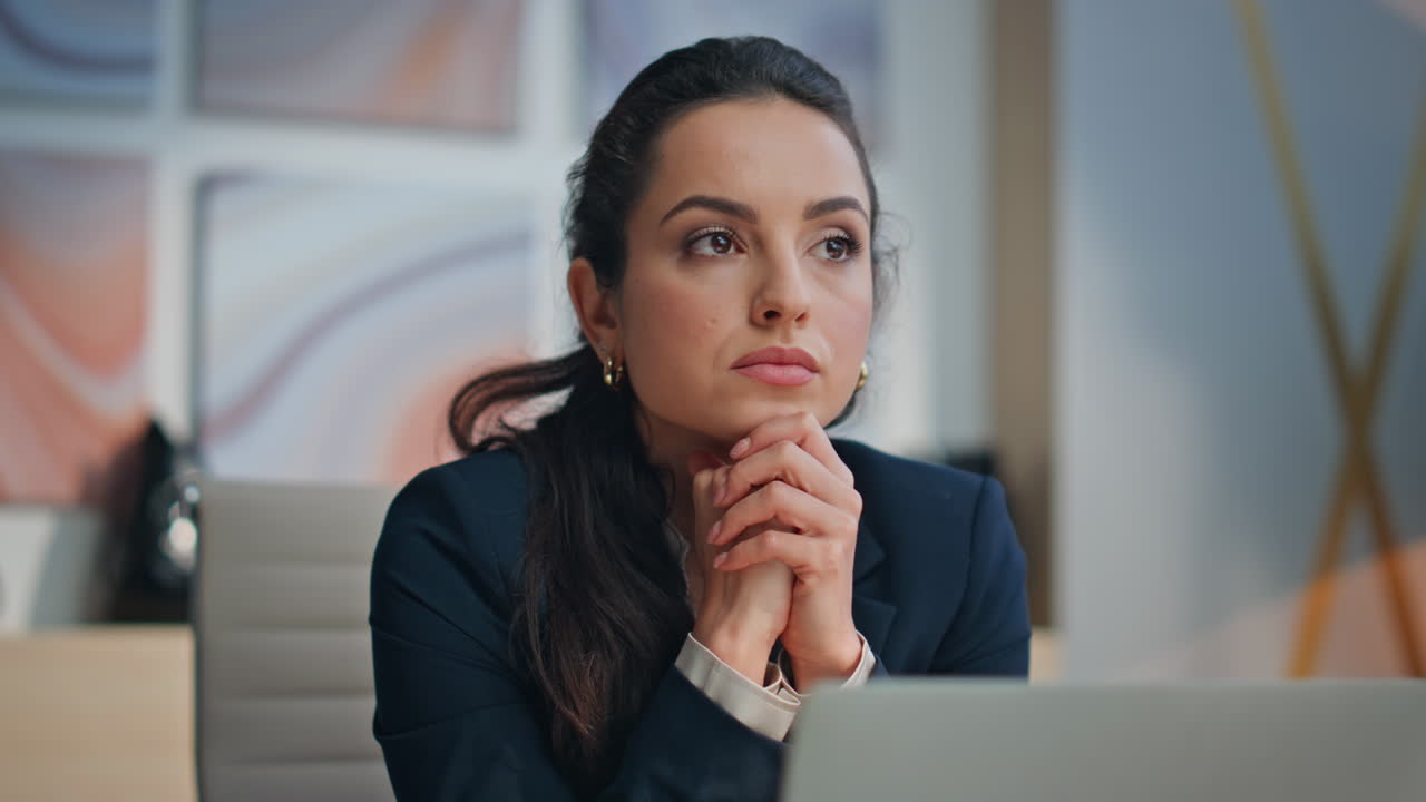 Sad woman thinking office at computer table closeup. Tired executive pondering