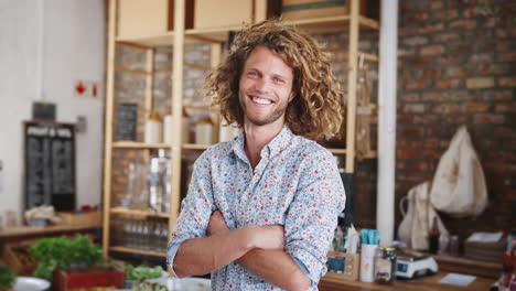 portrait of man shopping in sustainable plastic free grocery store