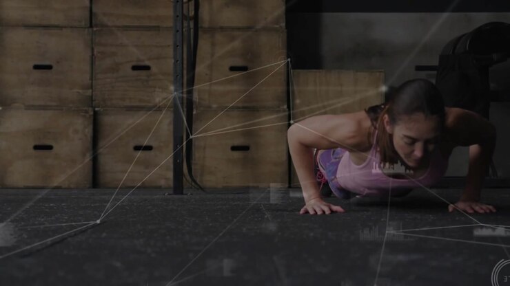 Midadult woman starting burpee by bending and placing hands training with net overlays on subject