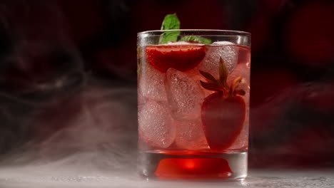strawberry mint cocktail with ice and smoke