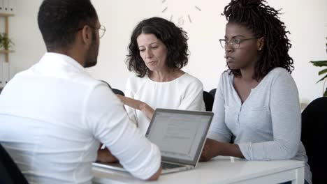 Thoughtful-business-people-talking-during-meeting.