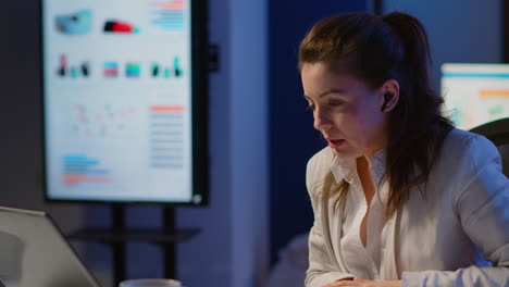 Employee-having-video-conference-working-overtime-from-business-office