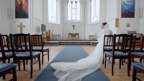 bride sitting in church during wedding ceremony