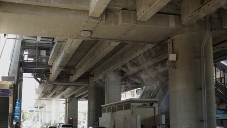misting system under elevated concrete skytrain tracks in bangkok