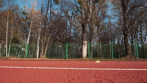 athletic woman running on track. healthy fitness lifestyle. beautiful body.