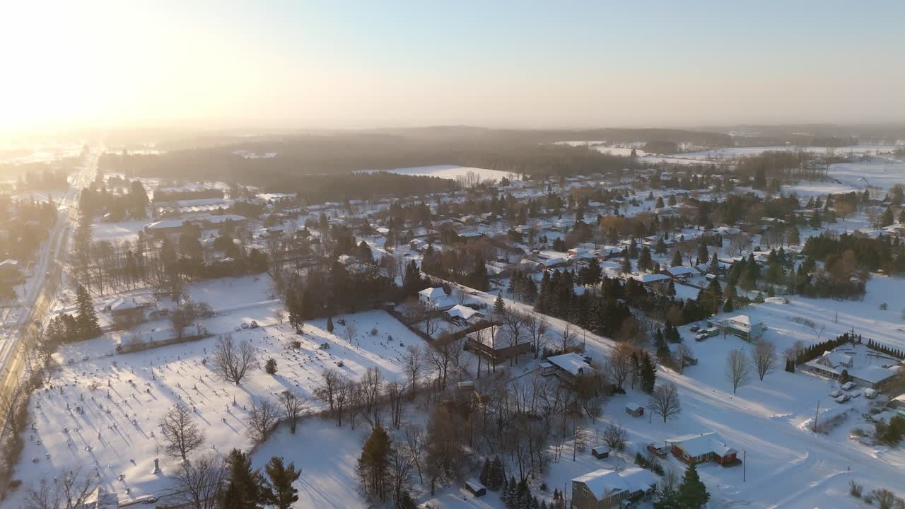 Snow-covered town of Alton, Ontario, aerial view during sunrise
